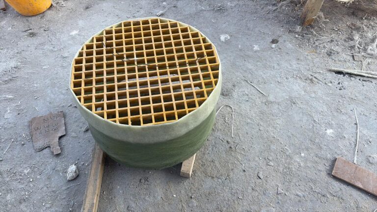 FRP grating over a chamber opening