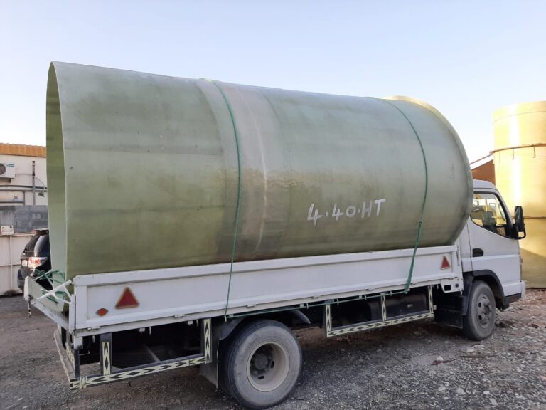 Cylindrical GRP tank loaded for delivery