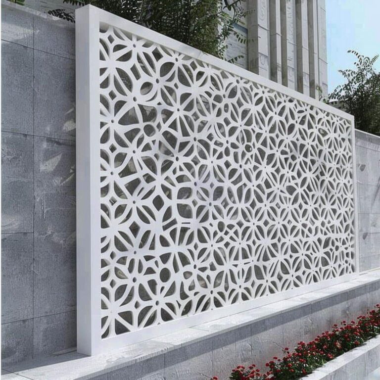 Perforated screen panels in a boundary wall